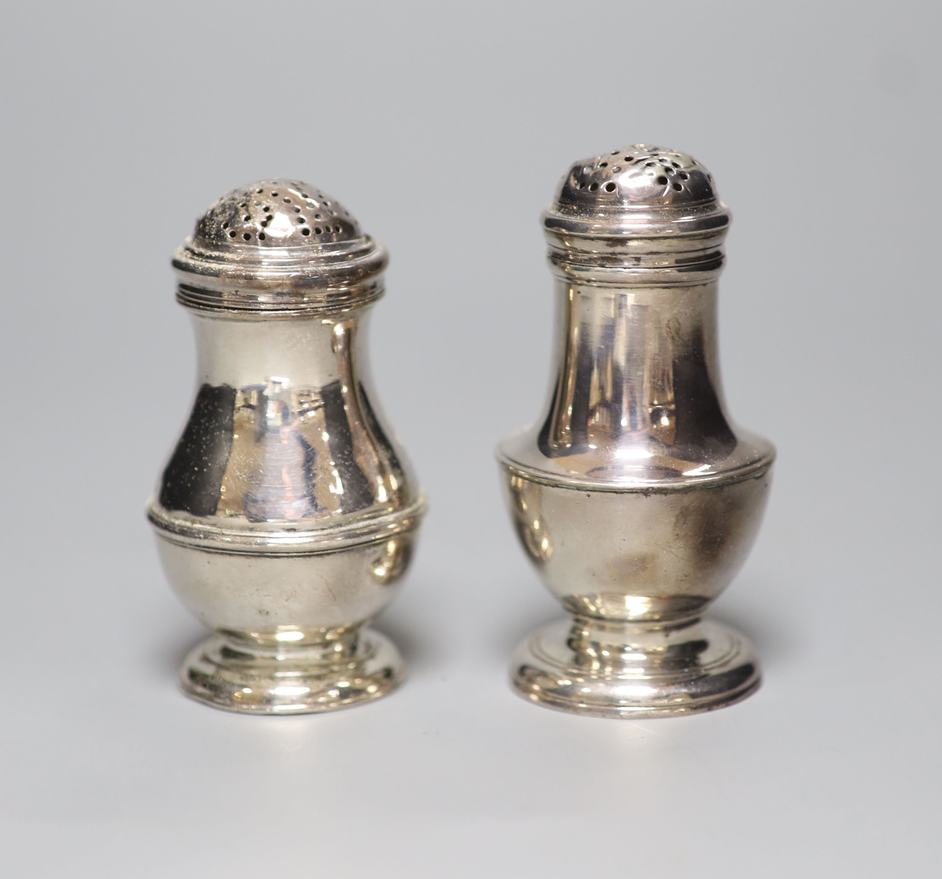 Two 18th century silver peppers, London, 1723 and London, 1757, the latter a.f.